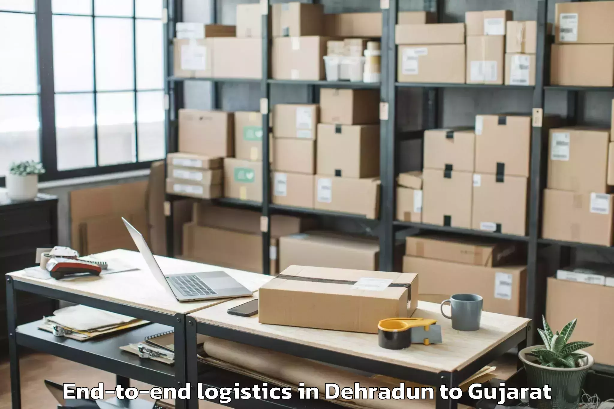 Book Dehradun to Deesa End To End Logistics Online